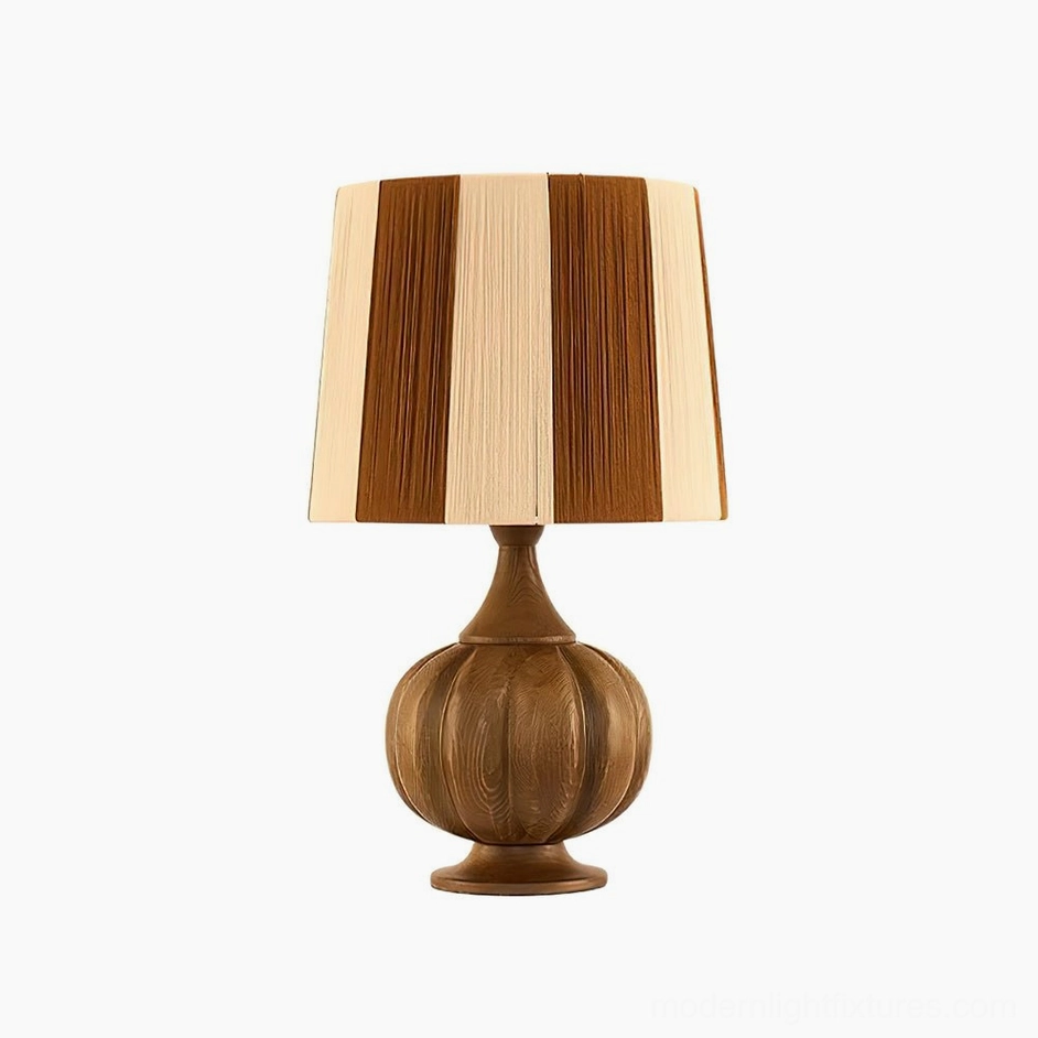 Walnut color and brown striped wooden table lamp in warm neutral interior with eclectic vintage furnishings