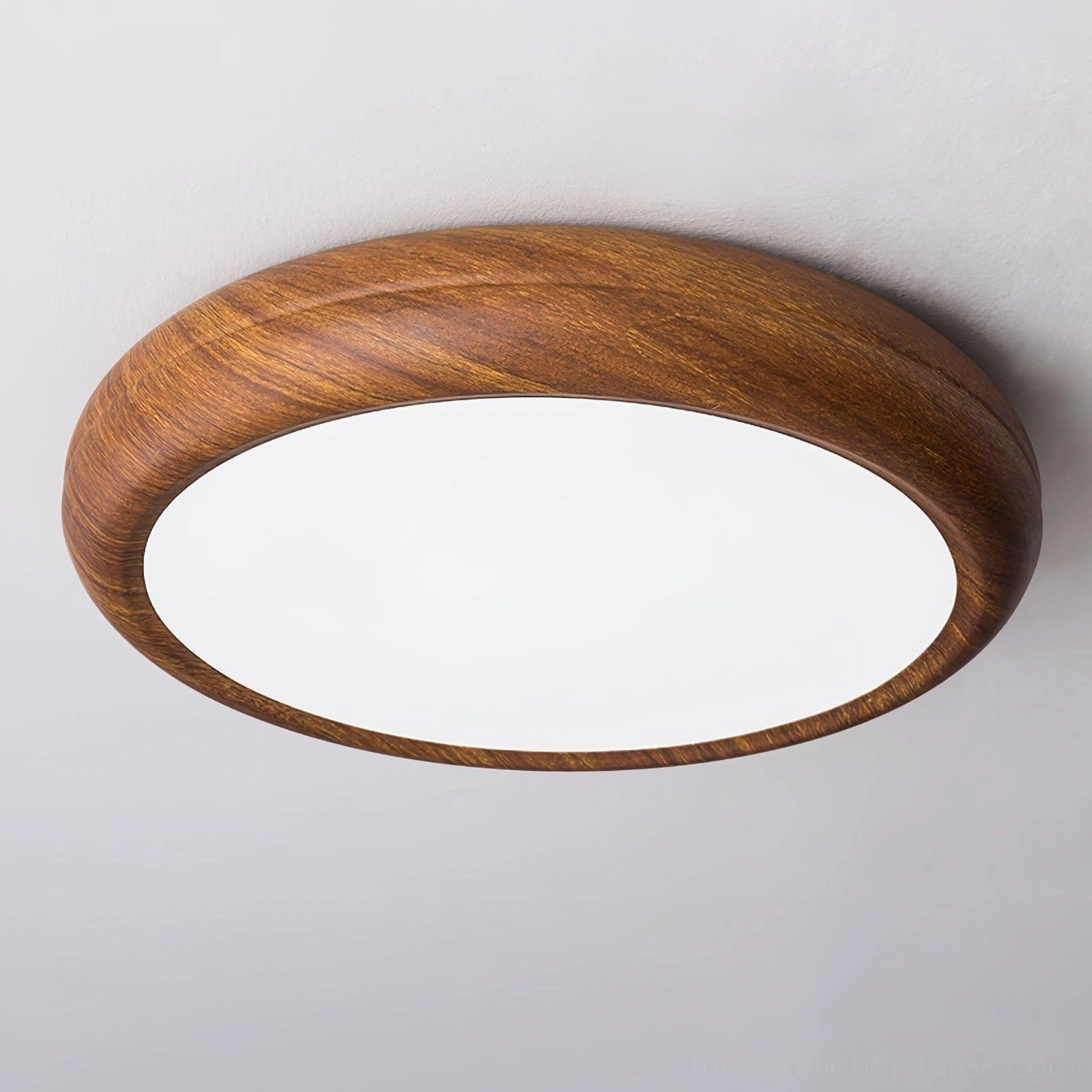 Round walnut wood grain ceiling light installed in contemporary living space with modern furnishings