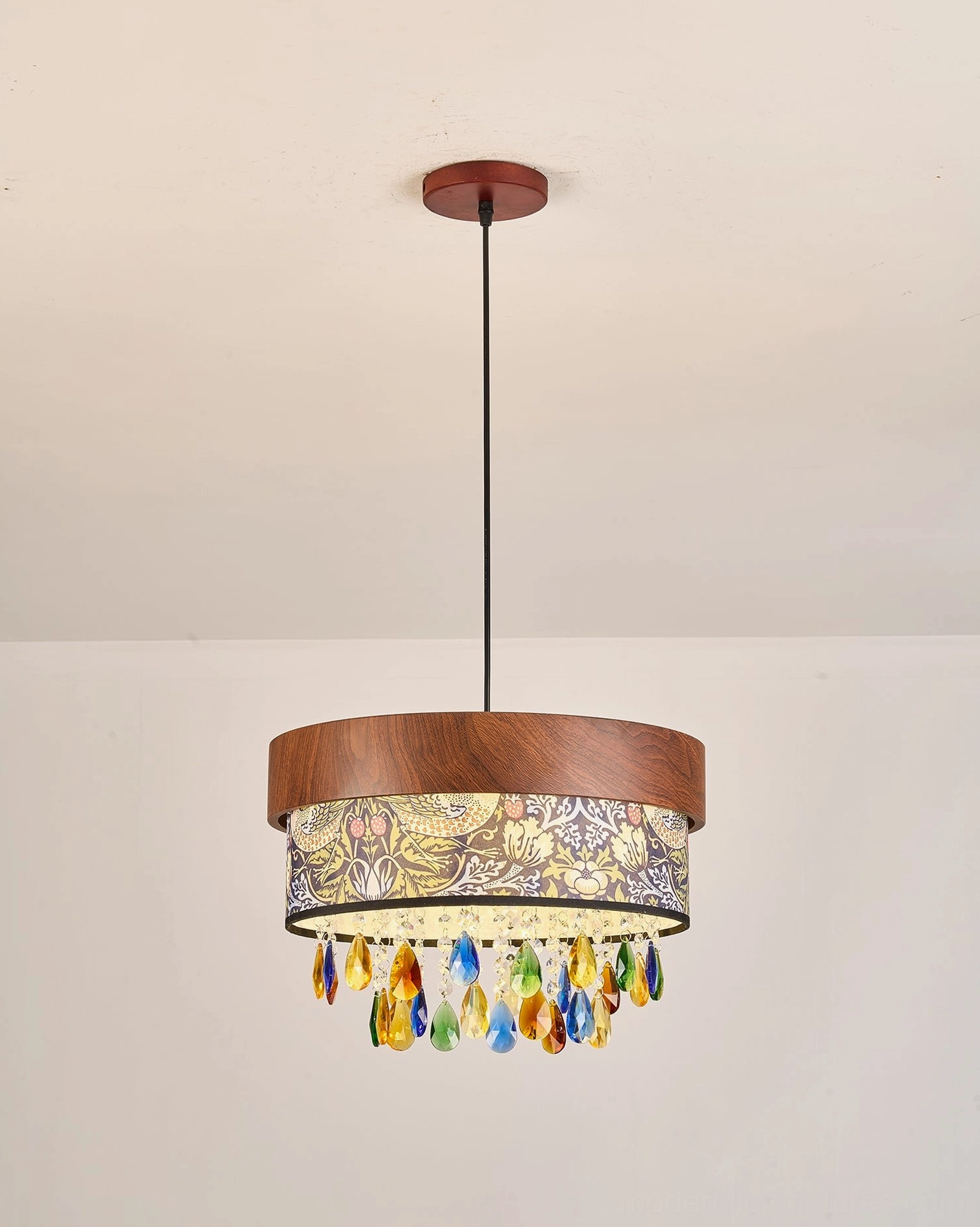 Walnut drum pendant light with printed shade and multicolor crystal teardrops, hanging view against neutral background