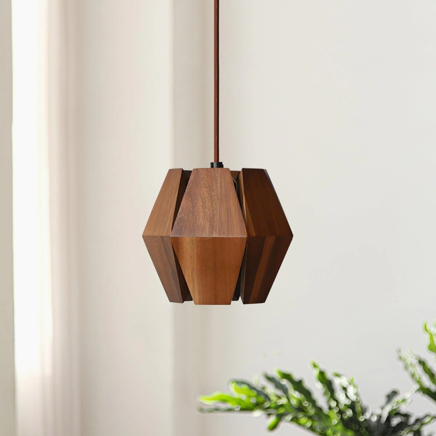 Faceted walnut wood pendant light showing intricate polygonal construction and assembly