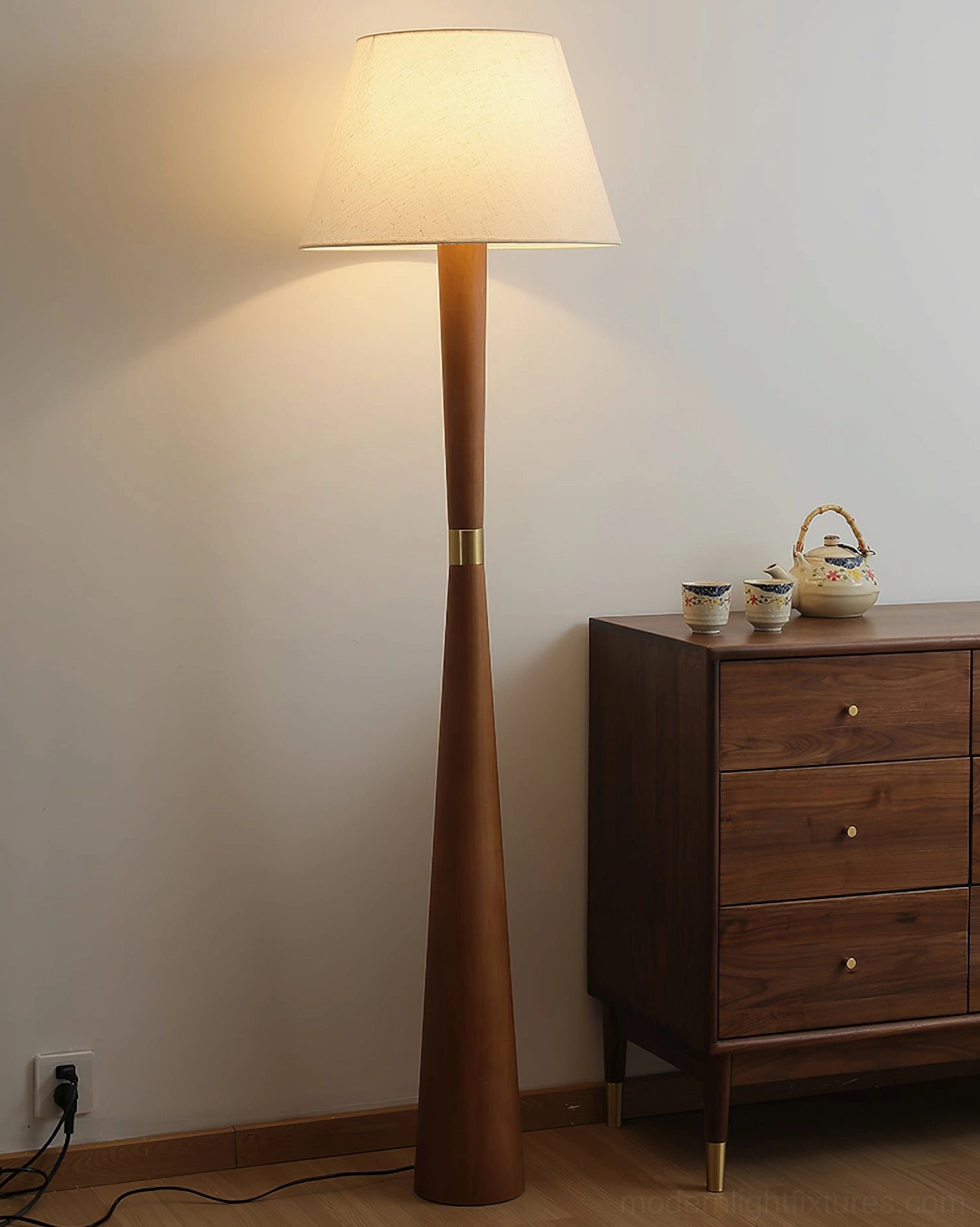Wooden floor lamp in walnut finish complementing contemporary interior design and mid-century furniture