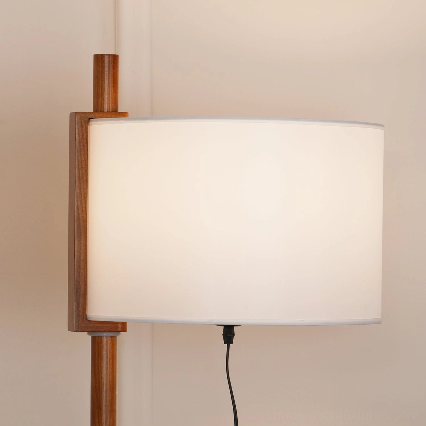 Walnut floor lamp with white shade styled in modern home interior, demonstrating versatile design compatibility