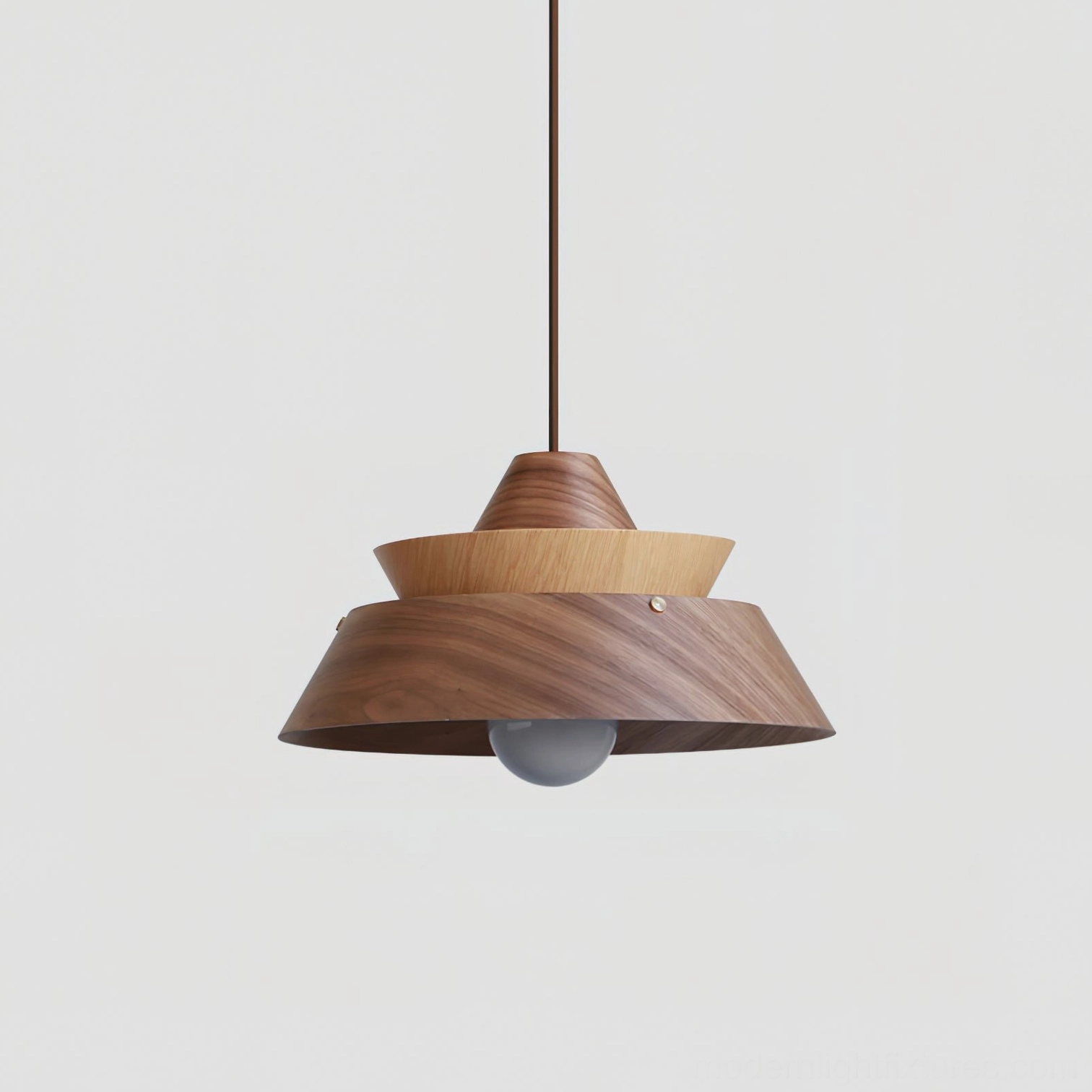 Walnut tiered pendant light hanging in modern dining room, showcasing natural wood grain and geometric design