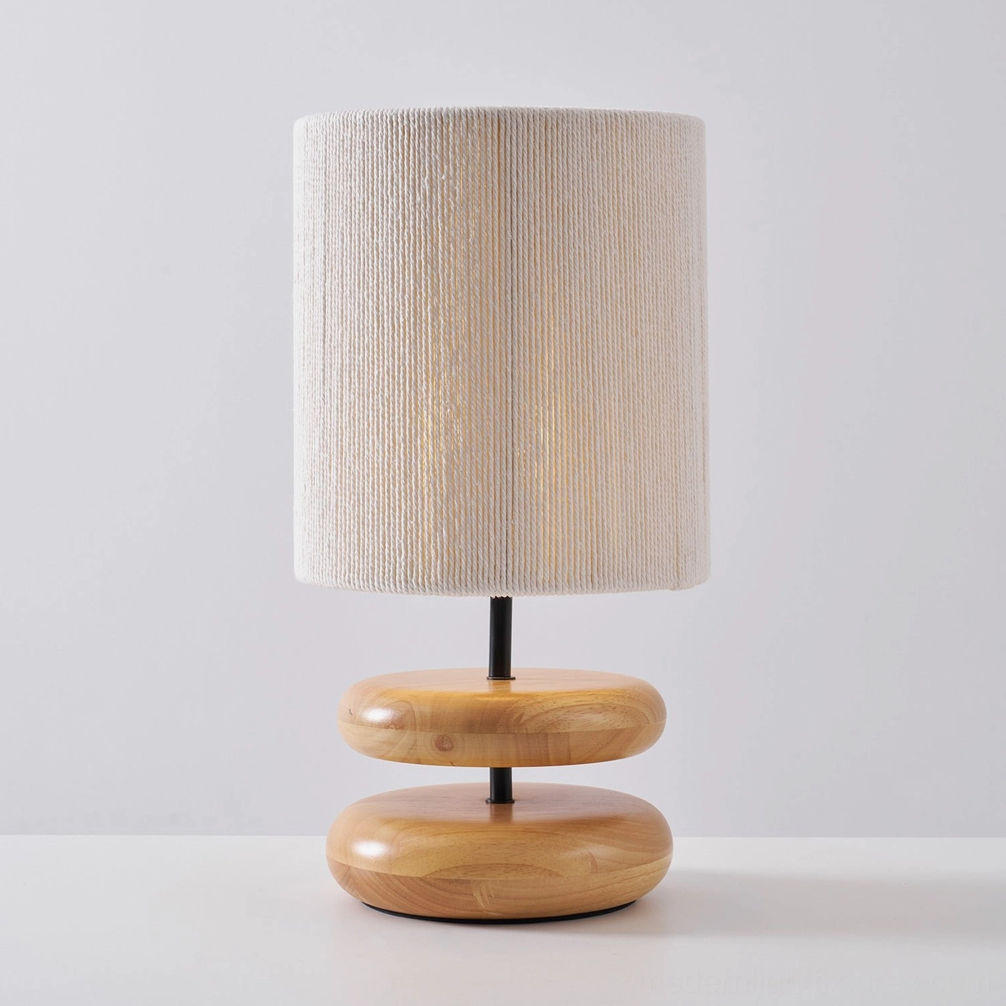 Walnut wood base lamp with beige pleated shade in scandinavian home interior
