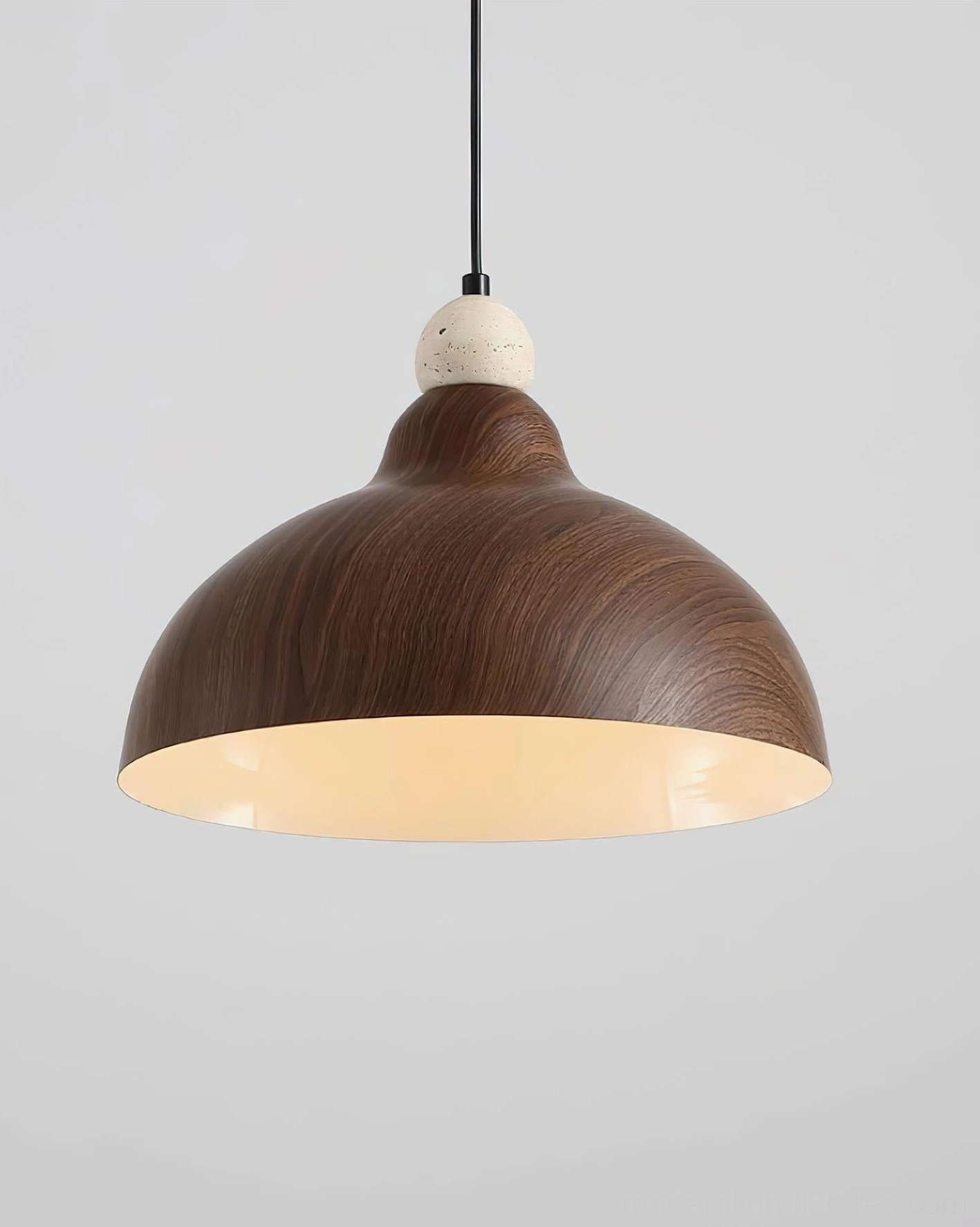 Walnut wood-grain metal dome pendant light with warm glow, three-quarter studio view