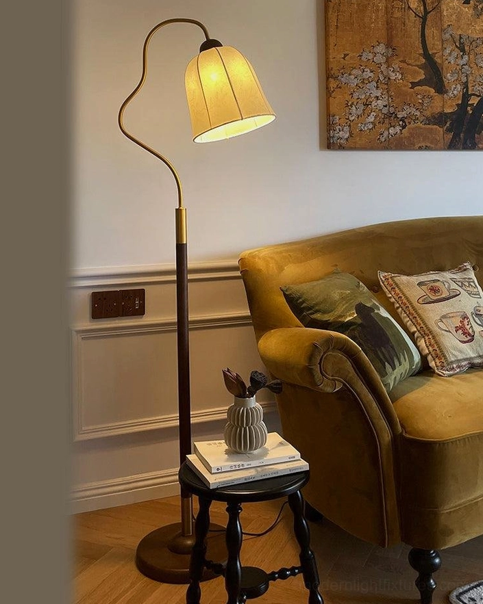 Walnut colored mid-century arc floor lamp with fabric shade, full room view showing versatile placement options