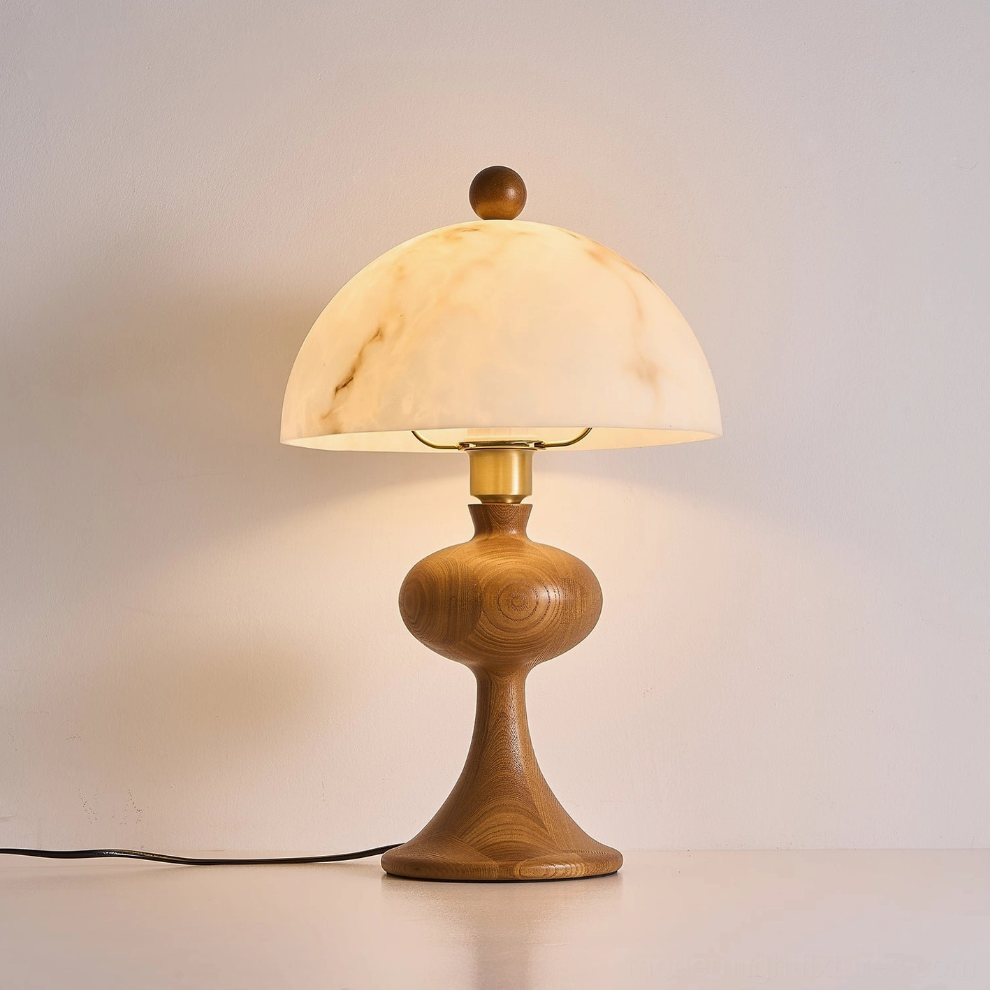 Modern wood table lamp with brass hardware details, three-quarter right view showing polished accents and marble-patterned shade
