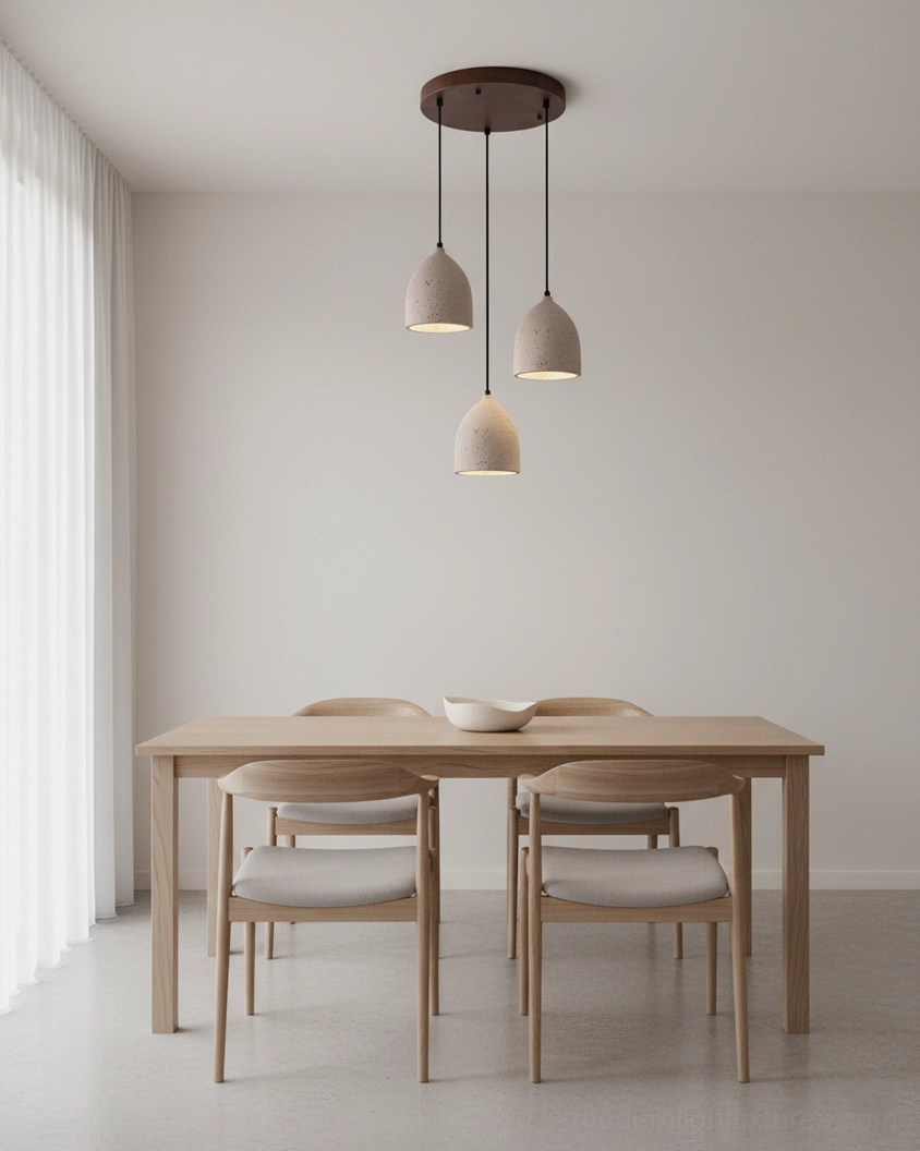 Walnut color travertine pendant lamp creating warm diffused glow in contemporary dining space