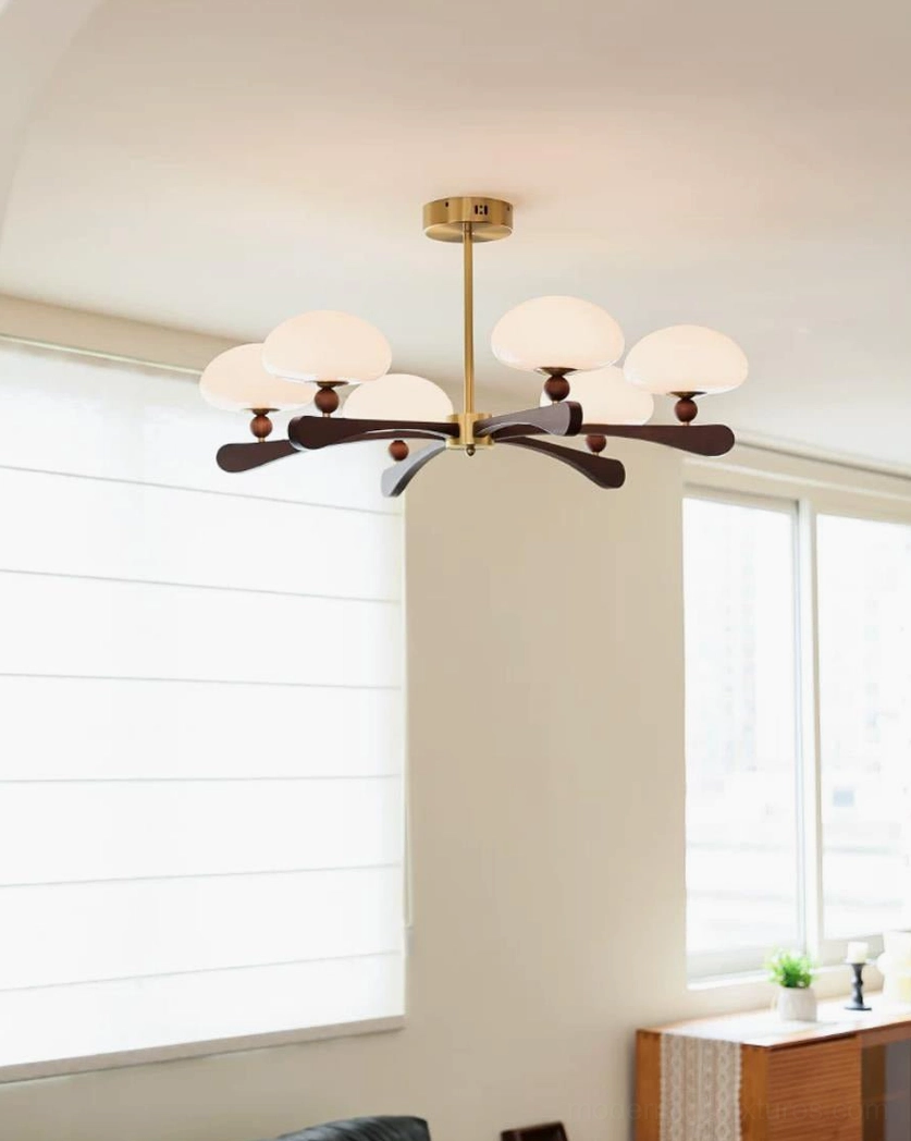 Walnut wood chandelier arm with natural grain texture, wood ball connector, and frosted opal glass shade detail—authentic material craftsmanship