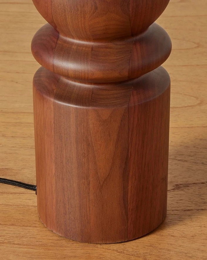 Close-up detail walnut wood base turned spindle grain pattern table lamp overhead view