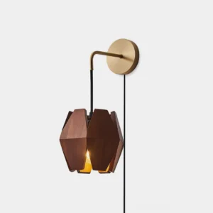 Walnut wood geometric wall sconce with brass accents shown in left front view against white studio background, showcasing polygonal lantern design