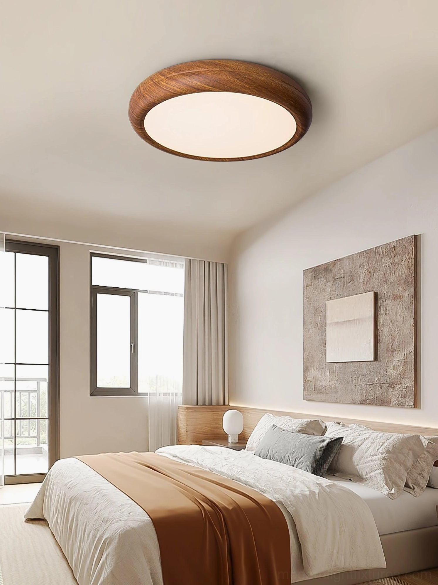 Close-up of walnut wood grain texture on round ceiling light fixture, natural material detail