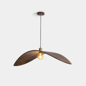 Walnut wood leaf pendant lamp with exposed brass socket and vintage bulb, studio product photography on white background
