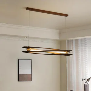 Dark walnut linear pendant lamp installed in contemporary living room with wall artwork, eye-level interior view
