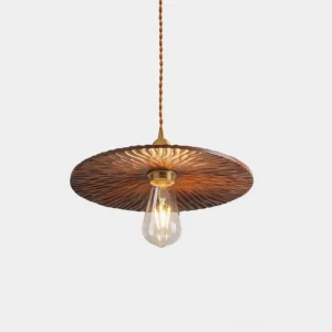 Modern walnut wood pendant light with brass hardware - front low-angle view in studio