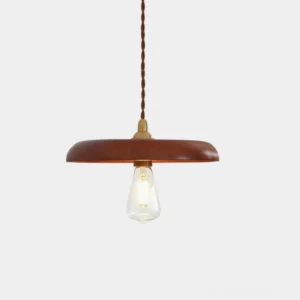 Walnut wood pendant light with brass fittings and twisted fabric cable on white studio background