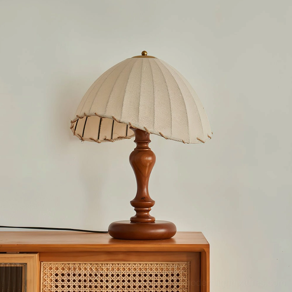 Vintage linen table lamp with off-white pleated shade and polished walnut wood base, right angle view
