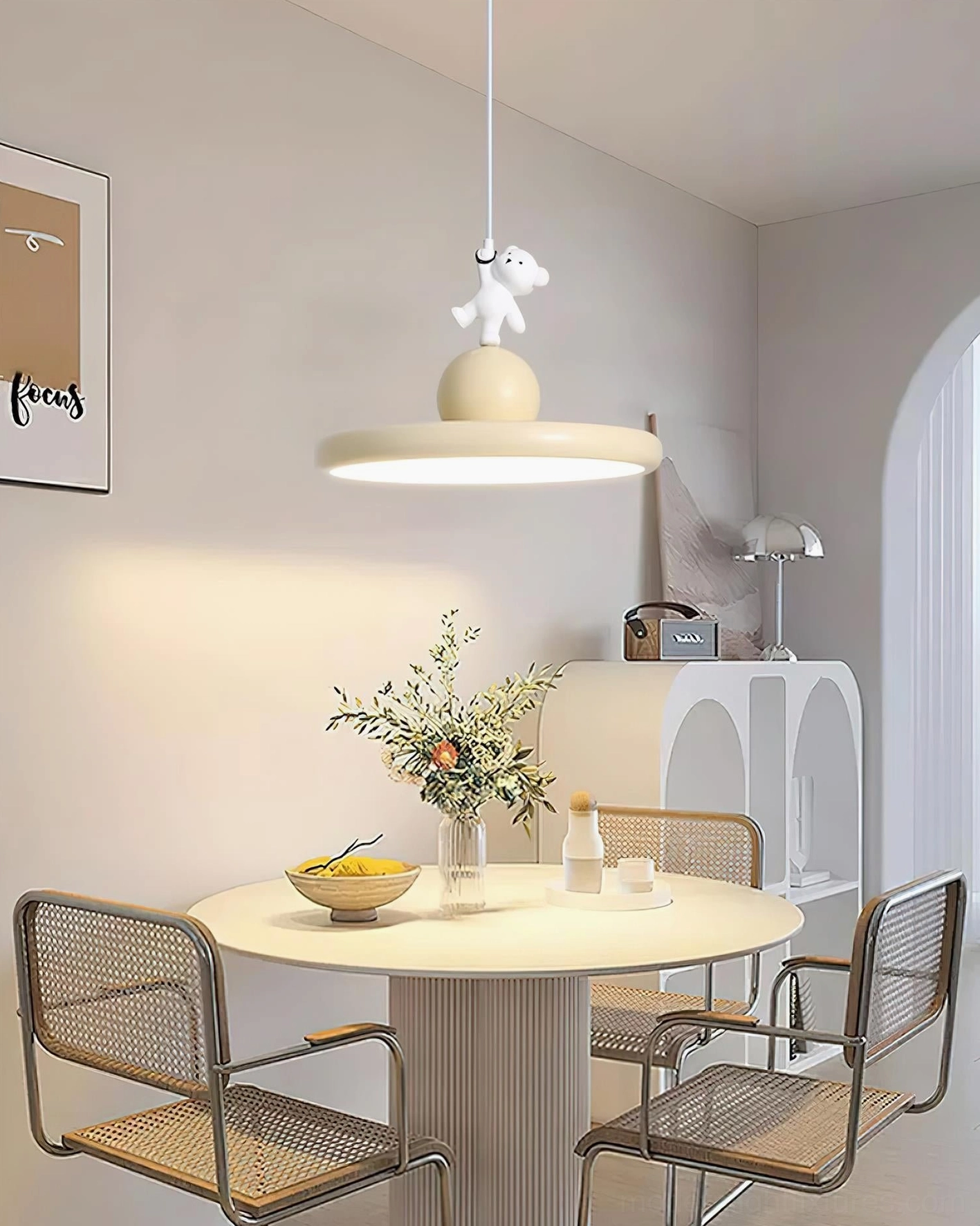 Charming bear pendant lamp creating warm lighting in family dining area, contemporary pendant light above rattan chairs