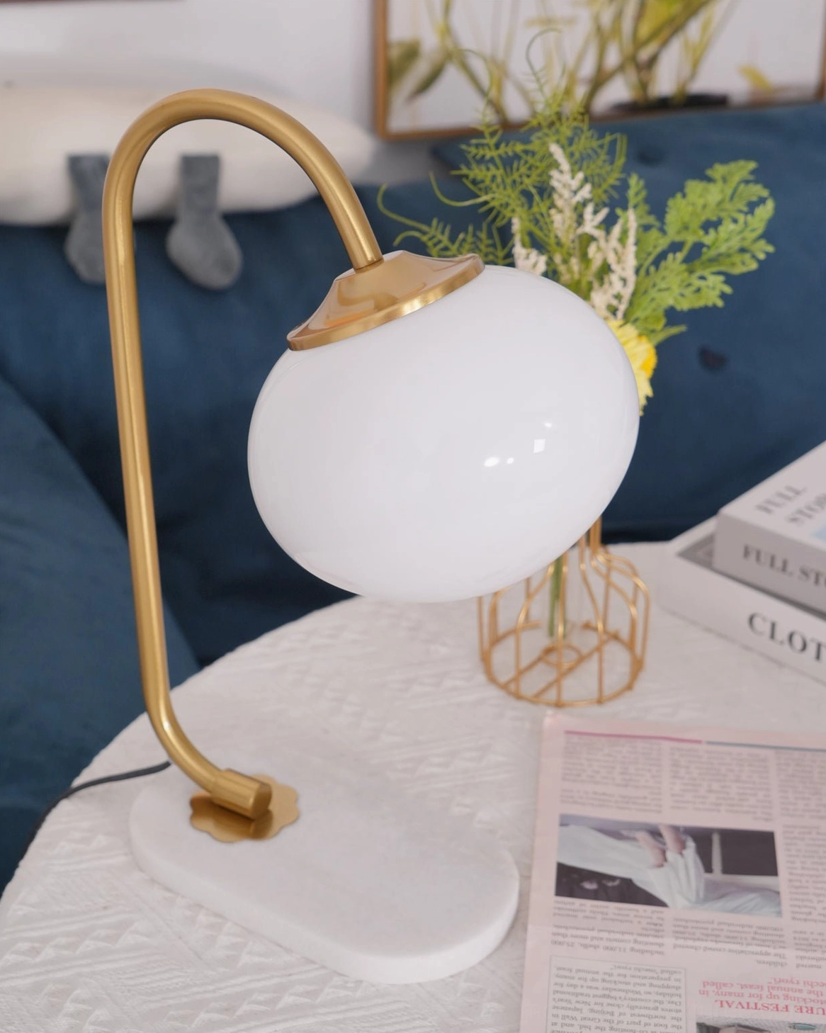 Warm glow globe table lamp with spherical shade and metal frame home lighting