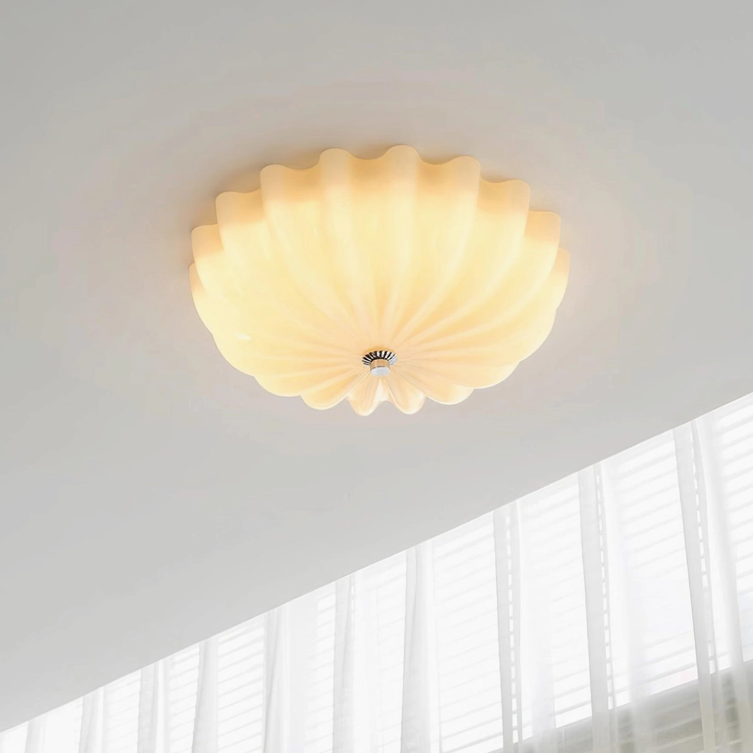 Illuminated jelly shell ceiling fixture with warm 3000K LED lighting, frosted ribbed glass shade, interior room view