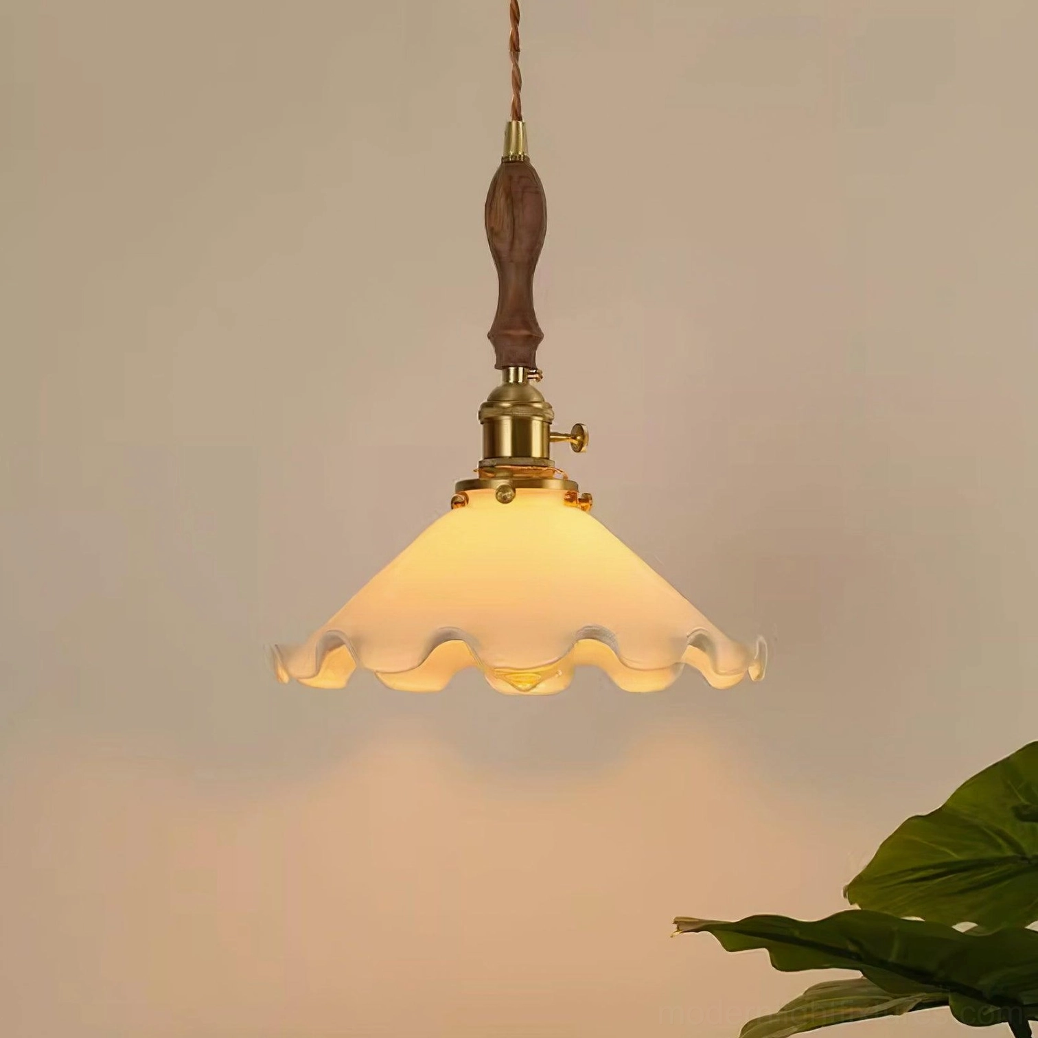 Warm glow vintage flower pendant with amber-tinted glass shade and brass switch detail