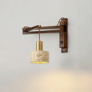Illuminated travertine wall sconce emitting warm ambient light, close-up detail of natural stone shade and brass metal accents