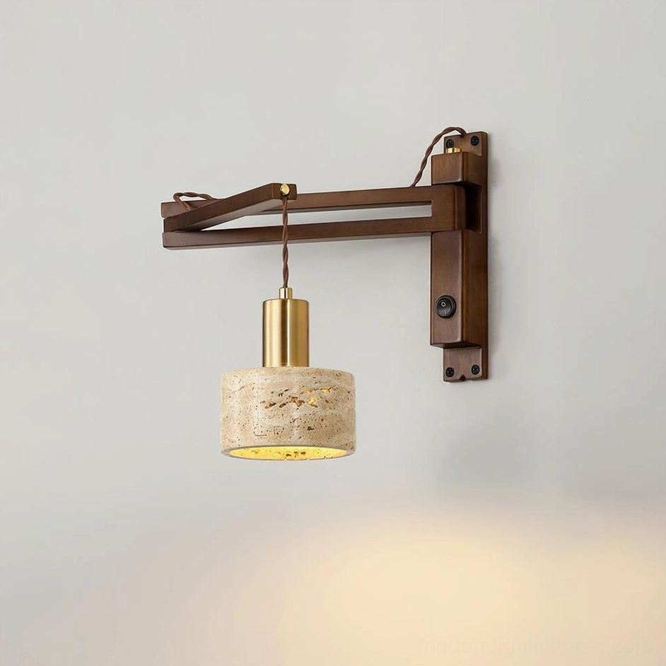 Illuminated travertine wall sconce emitting warm ambient light, close-up detail of natural stone shade and brass metal accents