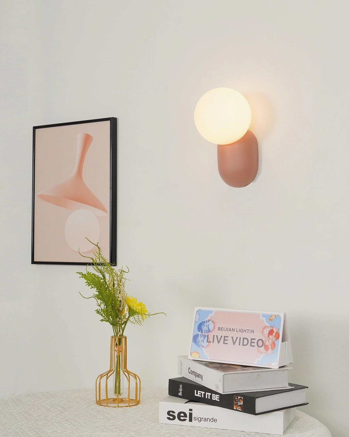 Warm white glass diffuser wall sconce creating inviting ambient lighting in contemporary bedroom