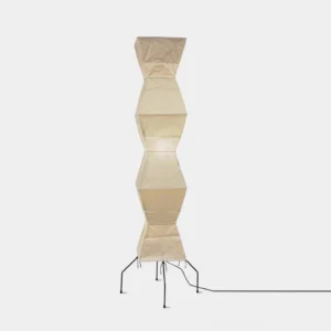 Beige washi paper origami floor lamp with black metal tripod base, front view on white background