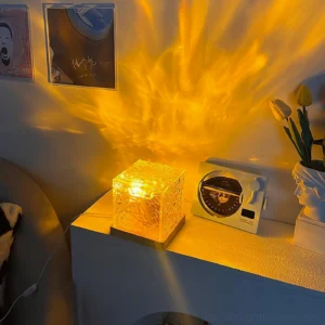 Warm amber LED water ripple table lamp on bedside table casting dynamic ripple light projection on wall, bedroom accent lighting
