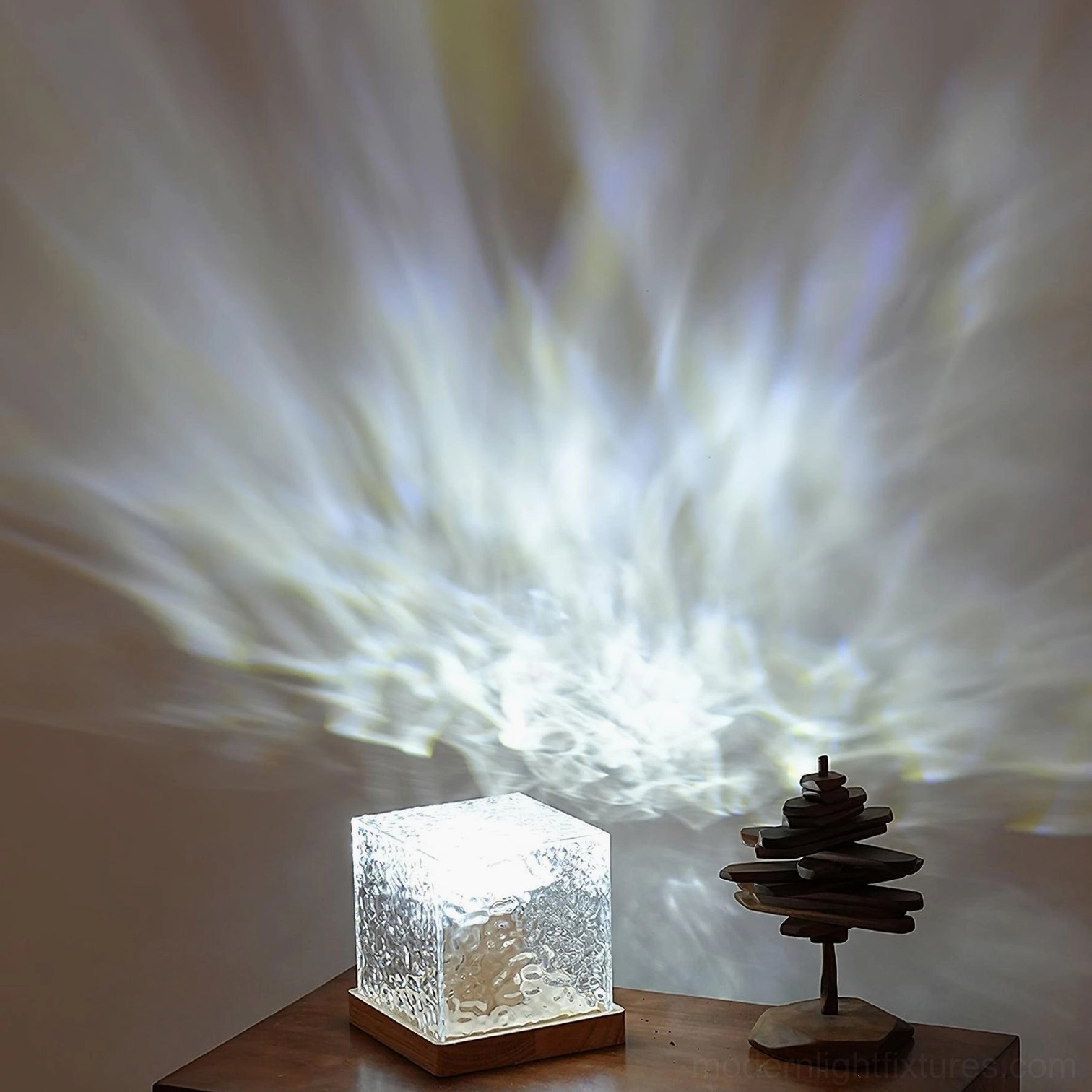 Cool white water ripple crystal table lamp on home side table with decorative tree ornament, bright ripple light projection