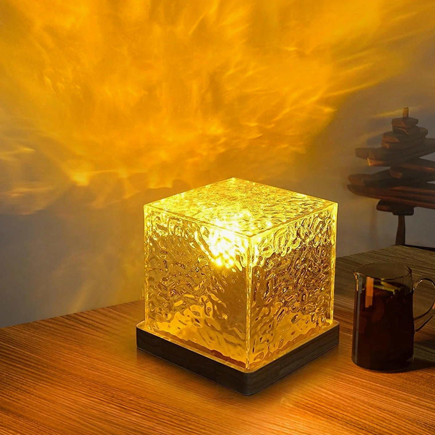 Warm amber water ripple table lamp on wooden dining table with bright glow casting large ripple pattern on wall