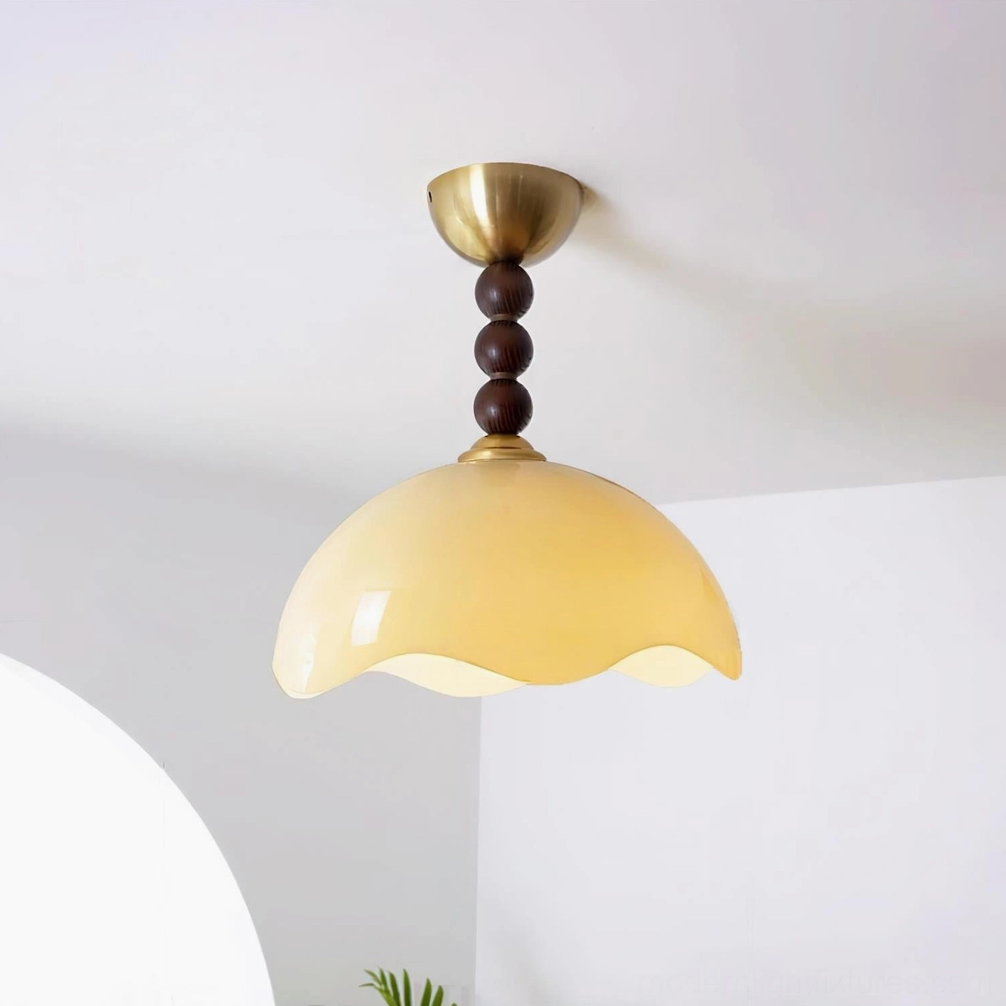 Wave Coralia warm-tone ceiling light installed in minimalist living room with mid-century modern decor