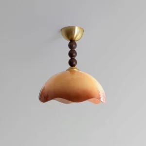Vintage-style Wave Coralia semi-flush ceiling fixture showing wavy glass dome and metal hardware against neutral wall