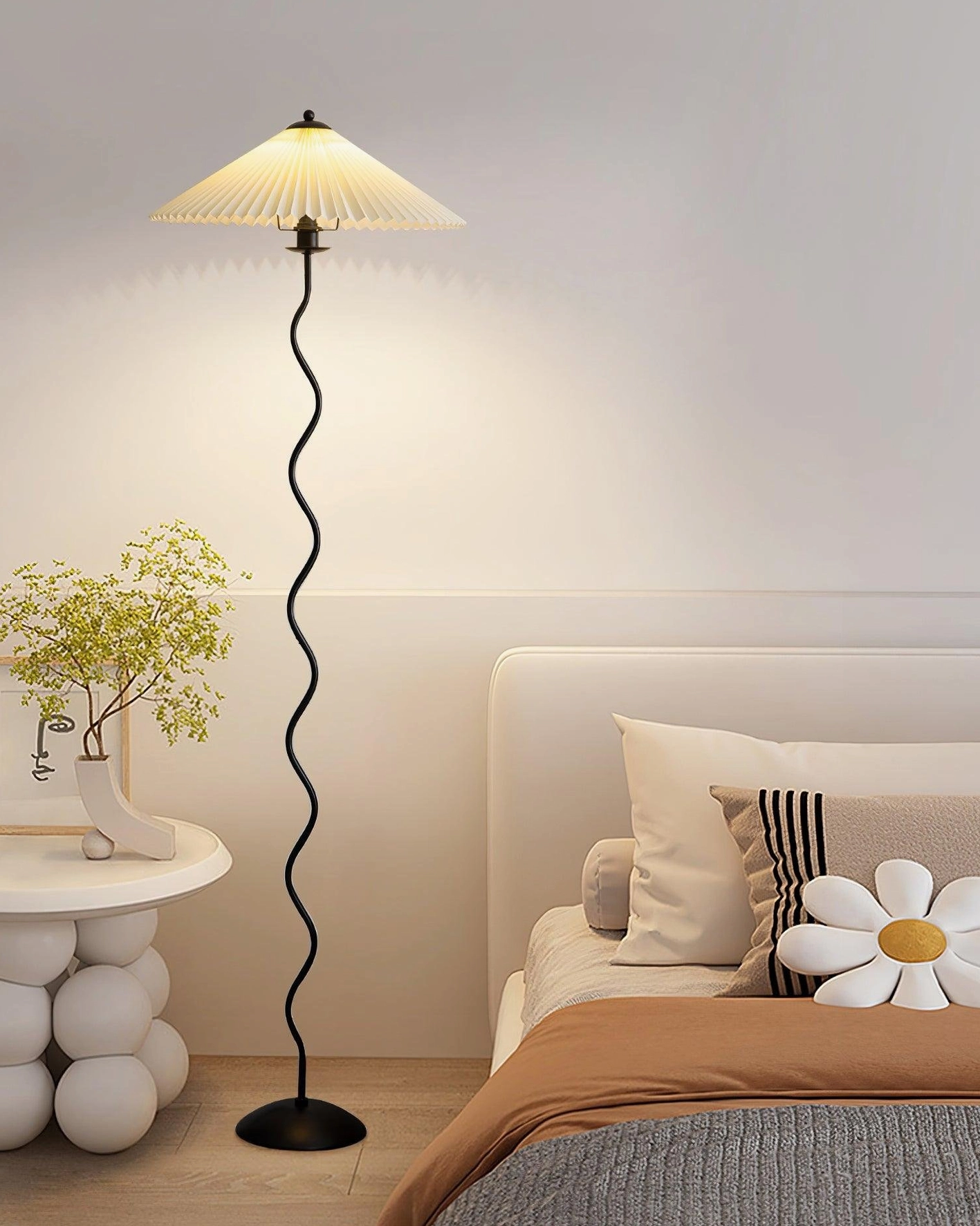 Dark wave floor lamp in bedroom with side table - bedside contemporary lighting fixture for modern sleeping spaces