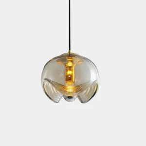 Modern wave glass pendant light with amber-tinted shade, studio overhead close-up view showing textured glass detail and metal fixture