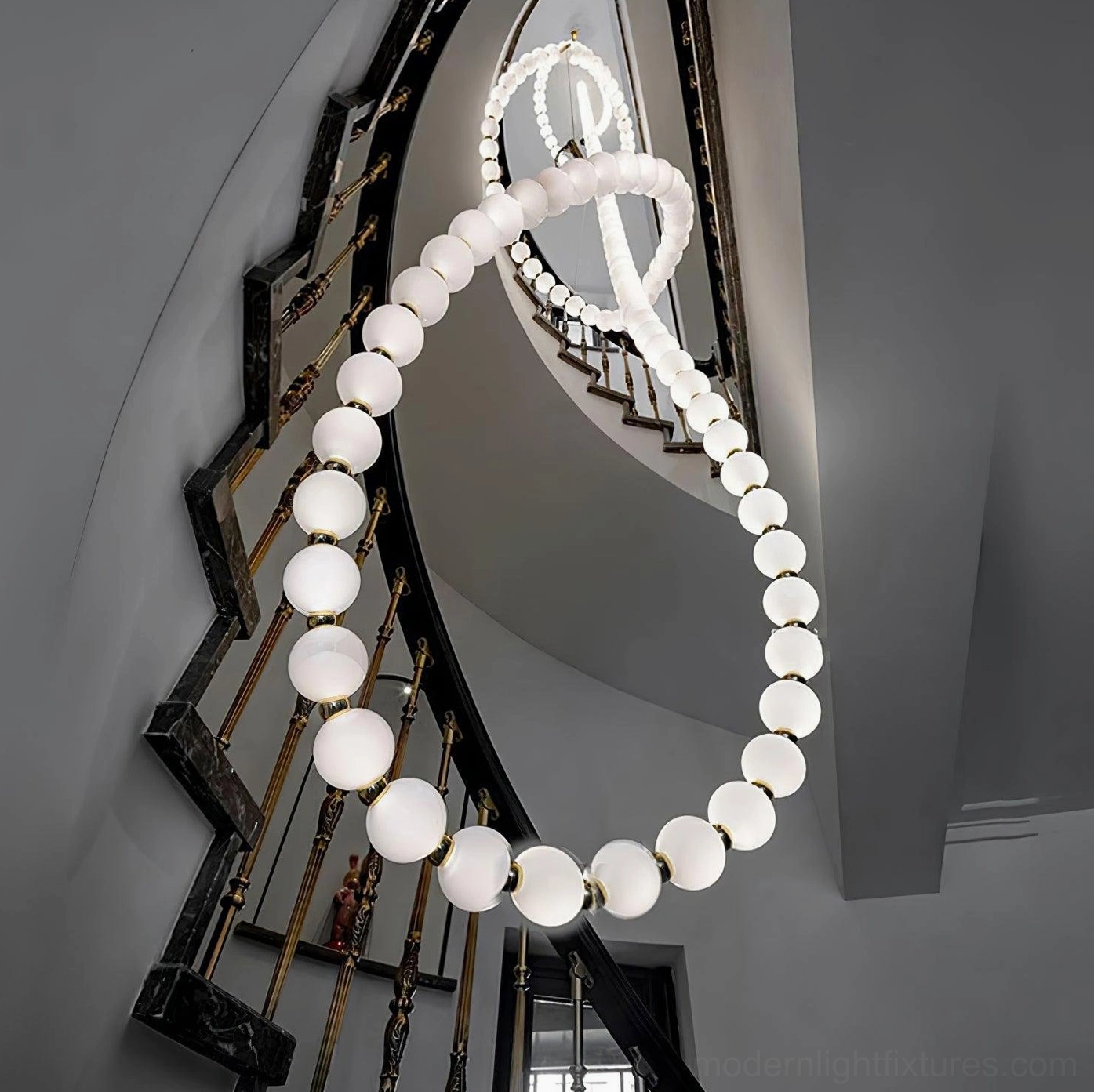 Wave pearl necklace chandelier with white frosted acrylic spheres in minimalist interior setting