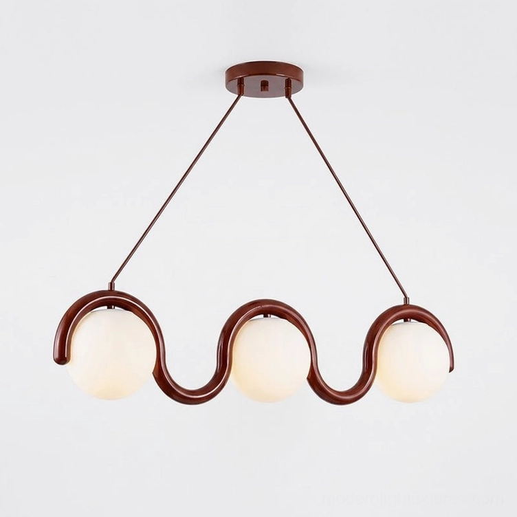 Modern linear wave pendant light with sculptural metal frame above dining table