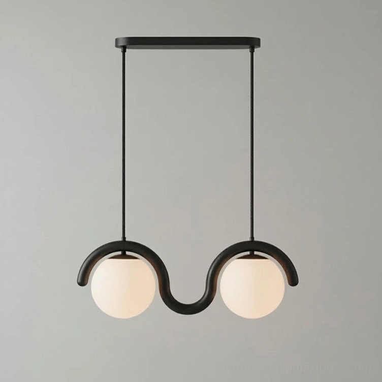 Linear wave pendant fixture illuminated showing warm ambient light from frosted glass globes
