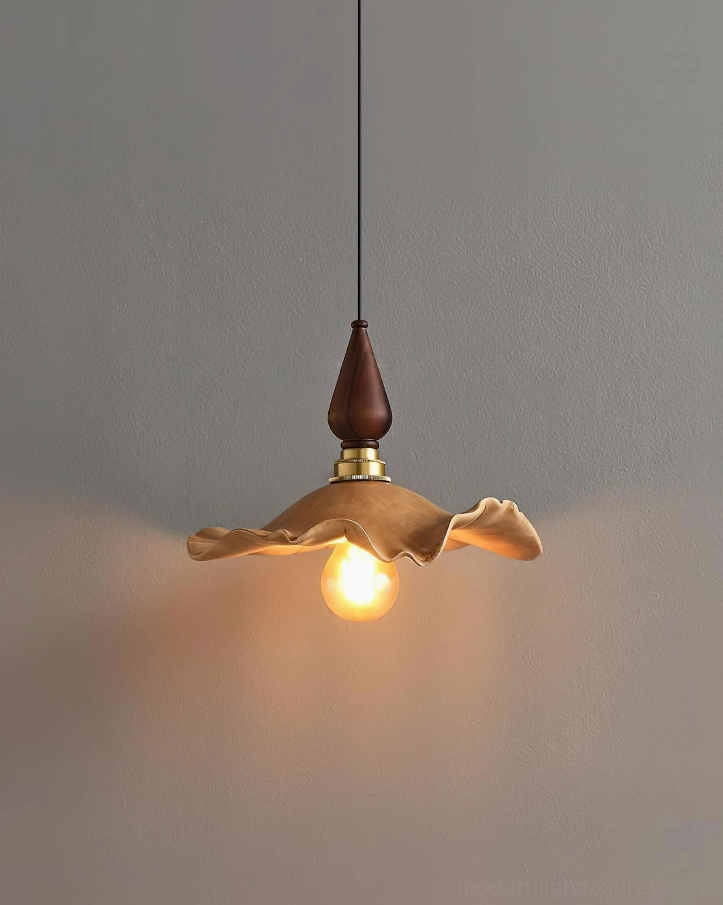 Wavely pendant light low-angle close-up featuring bright vintage bulb and intricately rippled resin shade surface