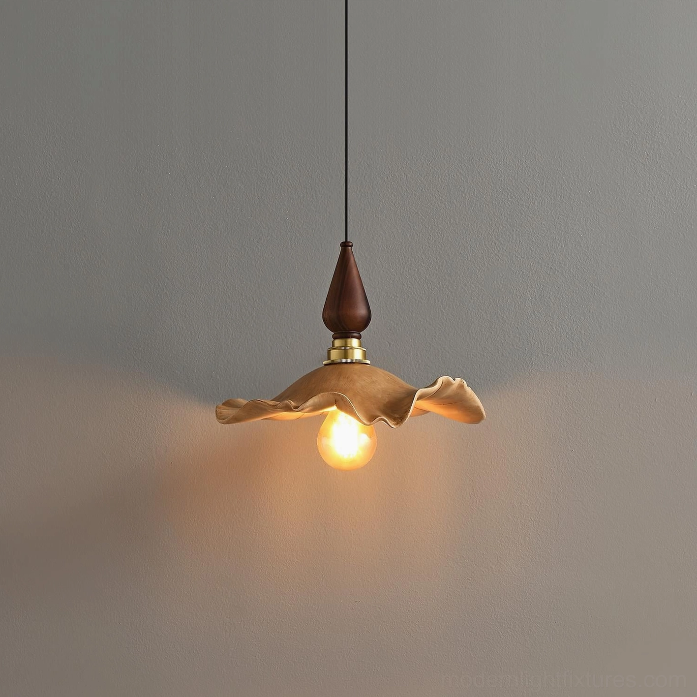 Wavely sculptural pendant light close-up showing detailed wave-textured resin shade with illuminated vintage bulb
