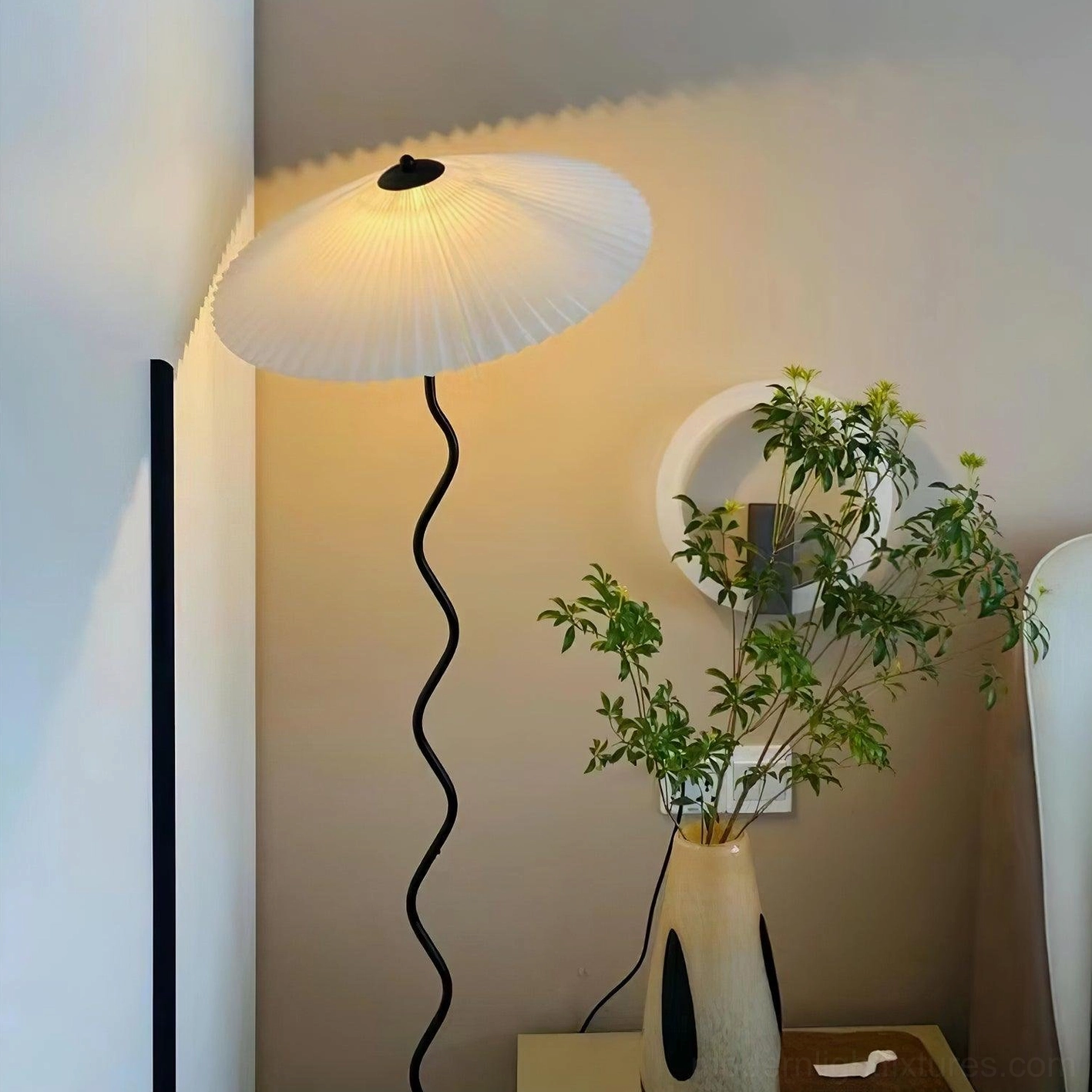 Contemporary wavy floor lamp beside modern furniture and decor - mid-century modern aesthetic lighting fixture