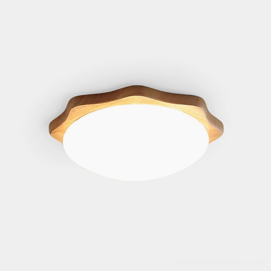 Wavy maple wood flush mount ceiling light with white acrylic diffuser, overhead front view on plain background showing minimalist Nordic design