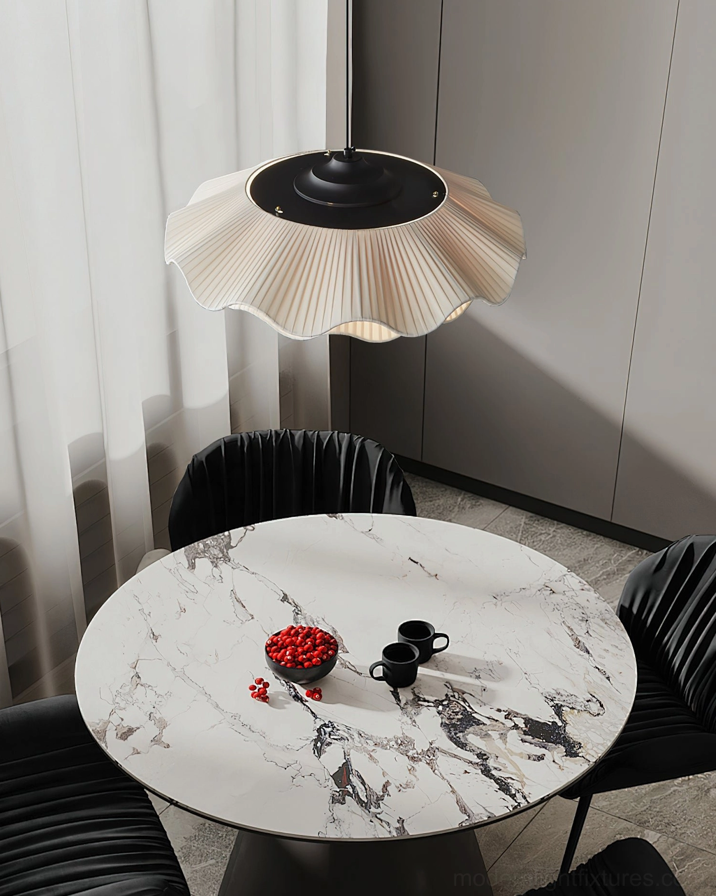 Sculptural pleated pendant fixture over luxury marble dining table with black leather chairs