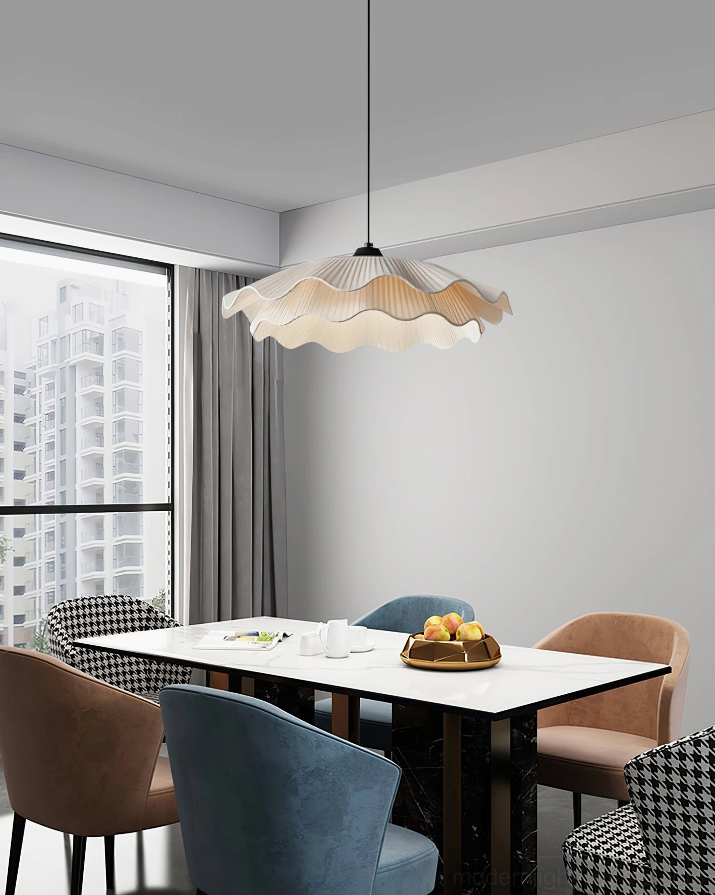 Minimalist dining area with modern rippled pendant light creating elegant focal point