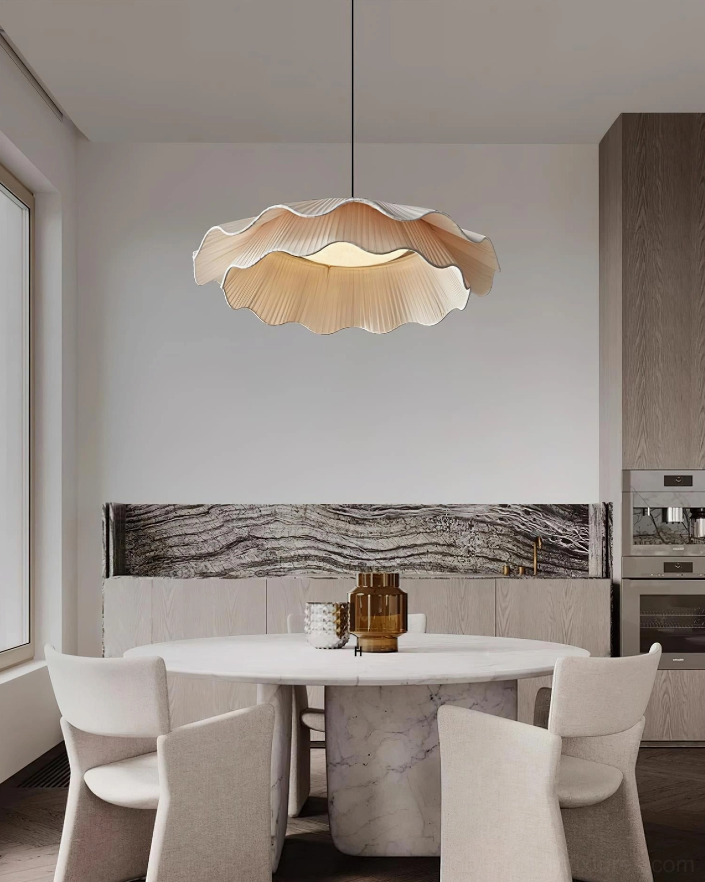 Modern ripple pendant light fixture in contemporary kitchen dining nook with warm beige tones