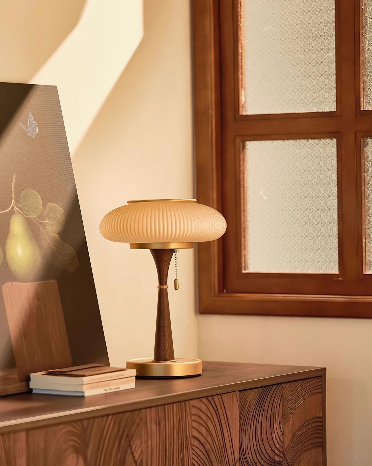 Welma pleated mushroom table lamp with brass trim dark wood stem amber ribbed shade on bedroom wooden dresser near window and art decoration