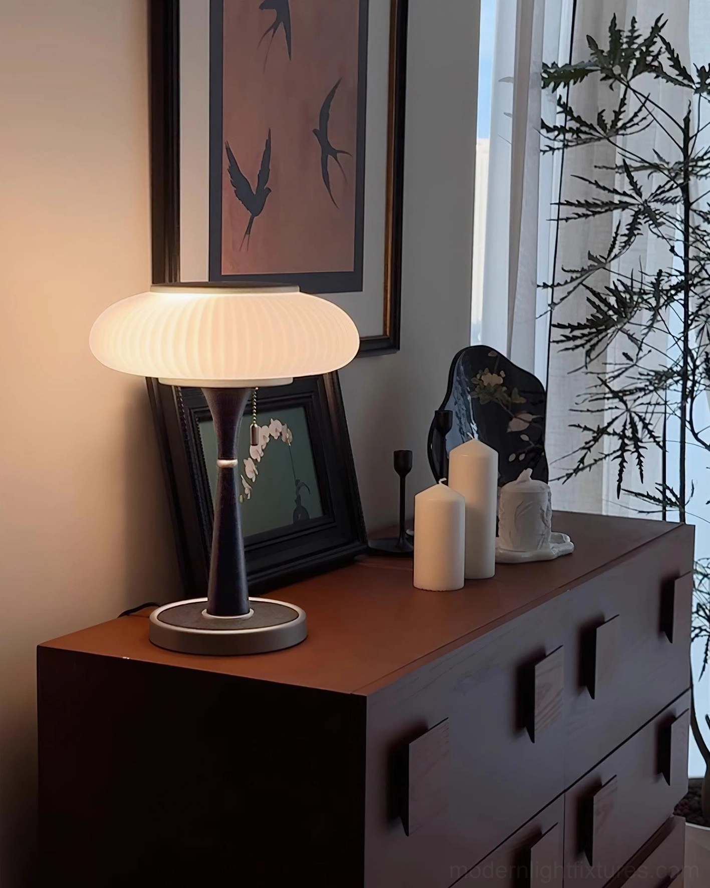 Welma mid-century modern pleated table lamp styled in contemporary home setting with complementary decor