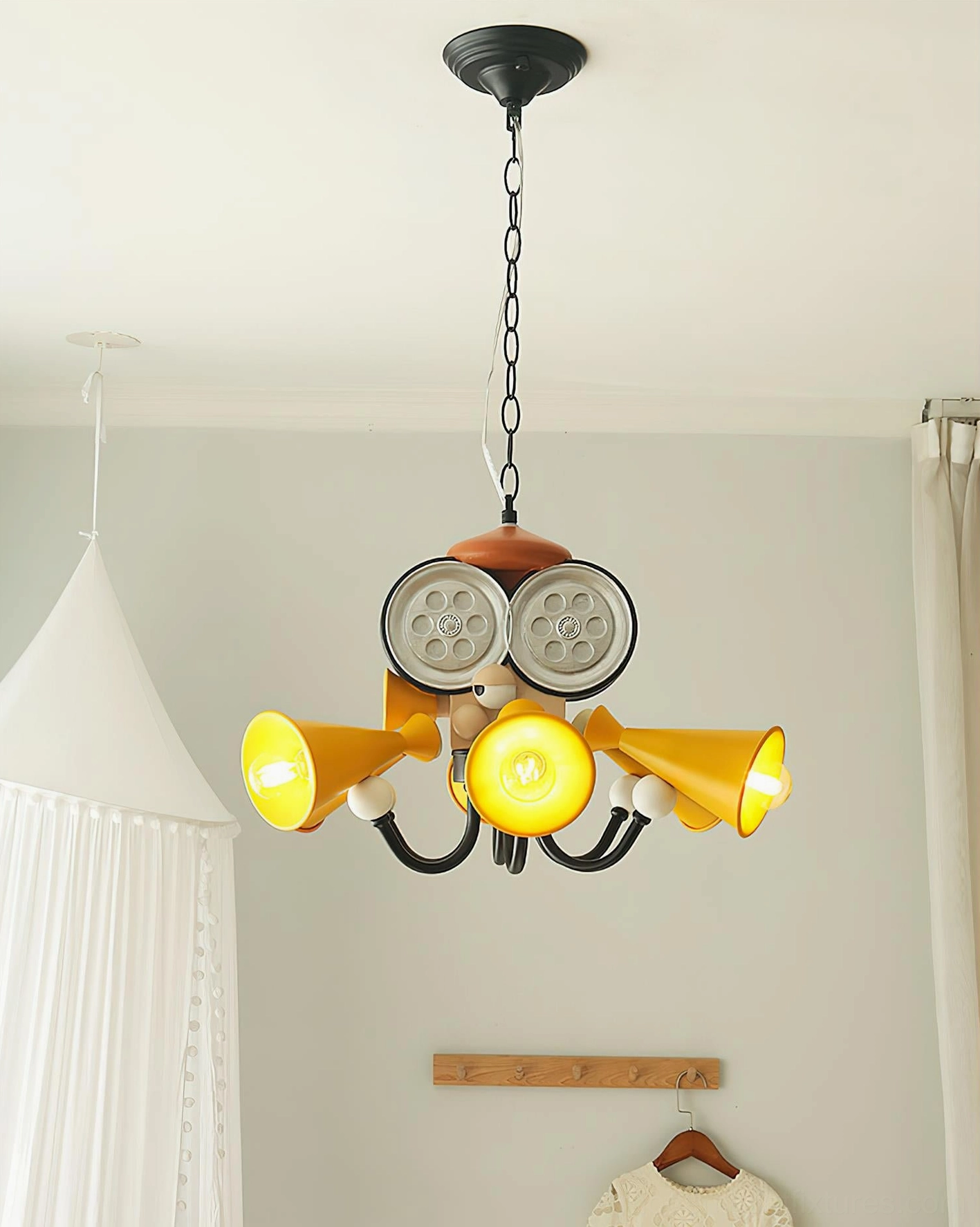 Octopus pendant light in cozy kids bedroom setting with hanging tent creating ambient indoor lighting atmosphere