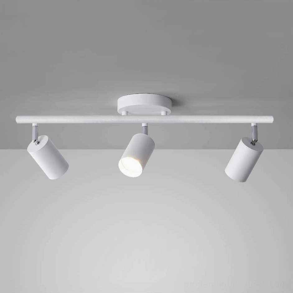 Modern white 5-head track ceiling light system, angled front view with minimalist matte finish design
